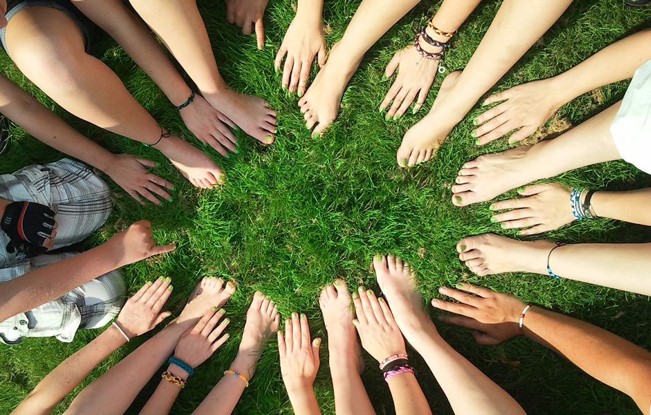 People sitting in circle on the grass